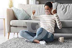 Online Profit. Joyful Happy African-American Woman Celebrating Success With Laptop At Home