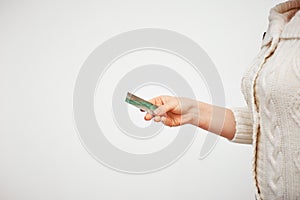 Online purchase with a credit card. easy control and money management. woman`s hand holding a plastic card