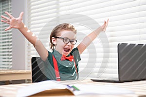 Online remote learning. Excited school kids with computer having video conference chat with teacher in class. Child