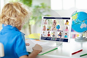 Online remote learning. School kids with computer