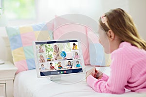 Online remote learning. School kids with computer