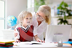 Online remote learning. School kids with computer