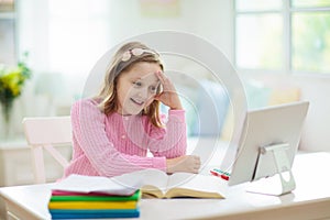 Online remote learning. School kids with computer