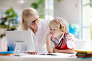 Online remote learning. School kids with computer