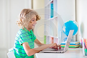 Online remote learning. School kids with computer
