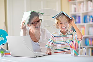 Online remote learning. School kids with computer