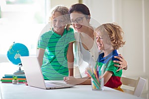 Online remote learning. School kids with computer