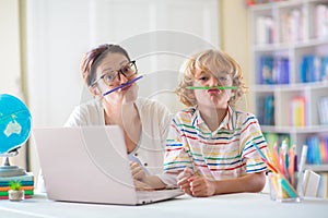 Online remote learning. School kids with computer