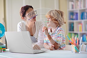 Online remote learning. School kids with computer