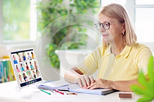 Online remote learning. Teacher with computer