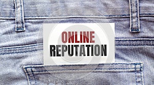 ONLINE REPUTATION words on a white paper stuck out from jeans pocket. Business concept