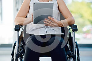 Online resources makes everyones job a little easier. an unrecognizable businesswoman using a digital tablet in the