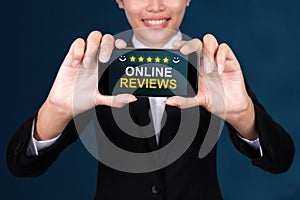 Online Reviews concept, Happy businesswoman Show text Online Rev