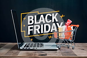 Online sale and Black Friday concept, laptop and shopping cart