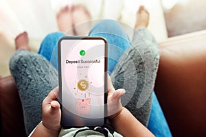 Online Saving Money for Kids Concept. Parent and Smart Child Using Mobile Phone to making Money Deposite via the Internet. E- photo