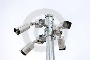 Online Security CCTV camera surveillance system outdoor of house. A blurred night city scape background. Real time Modern CCTV cam