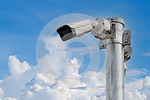 Online Security CCTV camera surveillance system outdoor of house. A blurred night city scape background. Real time Modern CCTV cam