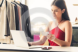 Online seller business woman working at office.