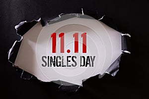 Online shopping of China, 11.11 singles day sale concept. Top view of Black torn paper and the text 11.11 singles day sale on a