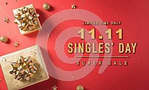 Online shopping of China, 11.11 singles day sale concept. Top view of golden christmas gift boxes with ribbon on red background