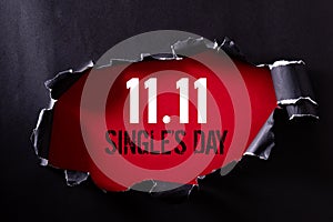 Online shopping of China, 11.11 single`s day sale concept. Top view of Black torn paper and the text 11.11 single`s day sale on