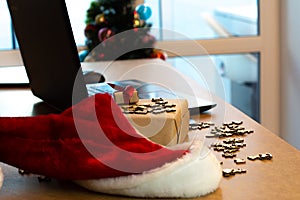 online shopping at Christmas, Happy New Year. Santa`s hat, gifts, laptop, Wallpaper, picture, postcard photo