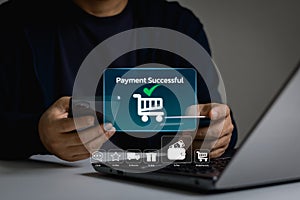 Online shopping concept. Customer holding credit card and using mobile phone and laptop computer to make payment for purchase