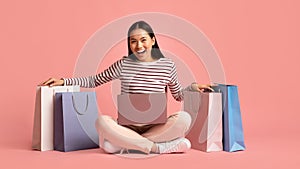 Online Shopping Concept. Happy Joyful Asian Woman With Laptop And Shopper Bags