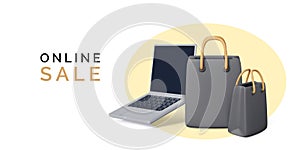 Online shopping concept. Laptop with black paper shop bags