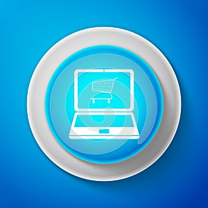 Online shopping concept. White Shopping cart on screen laptop icon isolated on blue background. Concept e-commerce