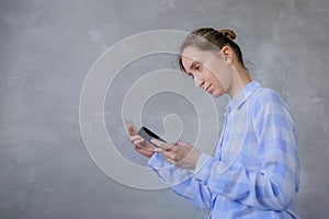 Online shopping concept - woman using smartphone and credit card
