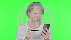 Online Shopping Failure on Smartphone for Old Woman on Green Background