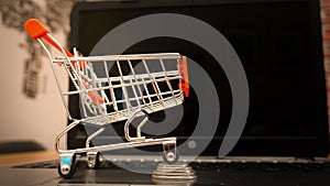 Online shopping illustration concept shot with miniature cart