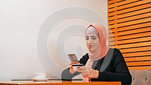 Online shopping mobile banking woman hijab buy