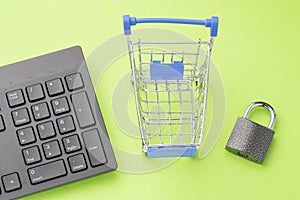 online shopping security, modern keyboard and shopping cart lock