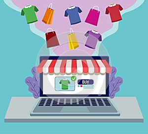 online shopping technology in laptop with shirts and bags