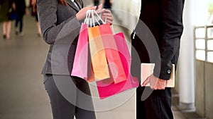 Online shopping website woman holding shopping bags buy products items at retail shopping mall. Couple lover buy items together bl