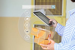 Online shopping, Woman hand holding smart phone and tracking parcel online to update status with hologram, Ecommerce and delivery