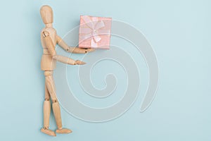 Online shopping, wooden mannequin shopping gifts. Online valentine, xmas shopping concept.