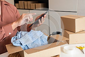 Online small business entrepreneur merchants working at store preparing products to deliver to customers, startup and online