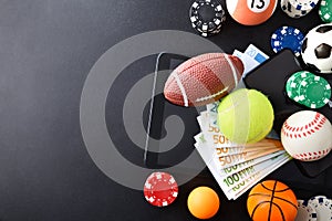 Online sports betting concept with balls and money on devices
