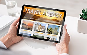 Online Travel Agency Website Opened On Digital Tablet In Female Hands