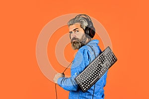 Online Video Game. Cyber Championship. agile business. downloading music from internet. bearded man headphones and