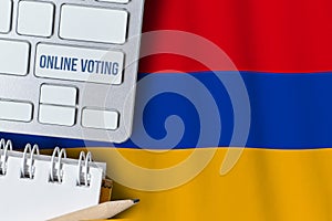 Online voting concept in Republic of Armenia. Keyboard near country flag