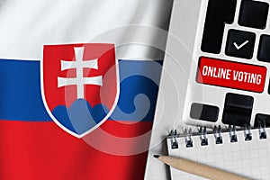 Online voting concept in Slovak Republic. Keyboard near Slovakia country flag
