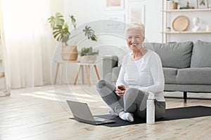 Online Workout. Elderly Woman Sitting In Front Of Laptop, Ready For Training