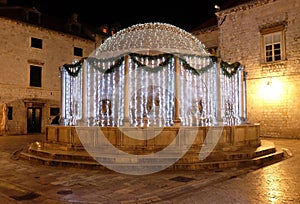 Onofrio fountain decorated with Christmas lights and ornaments, Dubrovnik