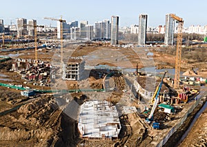 Ð¡onstruction site with foundation pit for monolithic reinforced skyscraper. Monolithic slab foundation and concrete pouring.