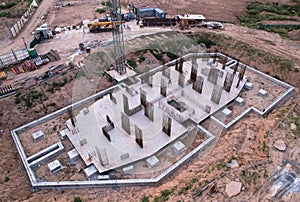 Ð¡onstruction site with foundation pit for monolithic reinforced skyscraper. Monolithic slab foundation and concrete pouring.