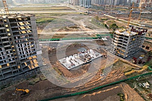 Onstruction site with foundation pit for monolithic reinforced skyscraper. Monolithic slab foundation and concrete pouring. First